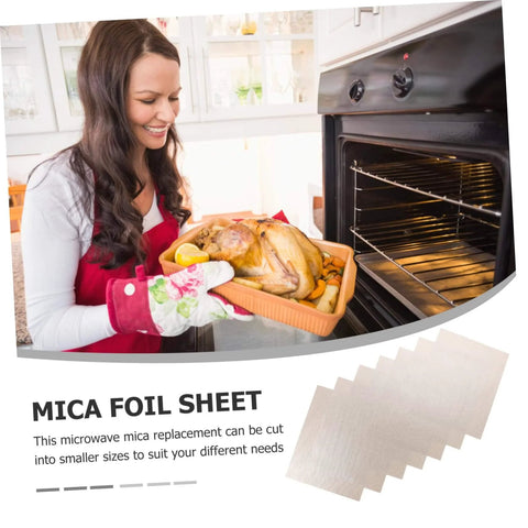 Woman using Must Have 10 Pack Mica Plate Sheets 150x120mm Heat Resistant Insulation For Microwave Ovens near an open oven