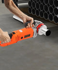 Portable 2300W Electric Pipe Threader With Copper Motor For Cutting And Threading Metal Plastic Pipes Includes Six Dies Ranging From One Half To Two Inches Plus Carrying Case Makes Job Super Easy Professional Grade Tool in use with hand gripping handle.