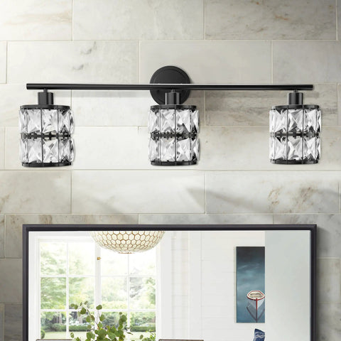 Matte Black 3 Light Vanity Fixture With Crystal Shades For Bathroom And Bedroom mounted above mirror on tiled wall