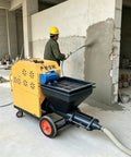 Premium Portable Mortar Sprayer Machine For Wall Plaster And Stucco Application Multifunctional Cement Pump in use for wall coating.