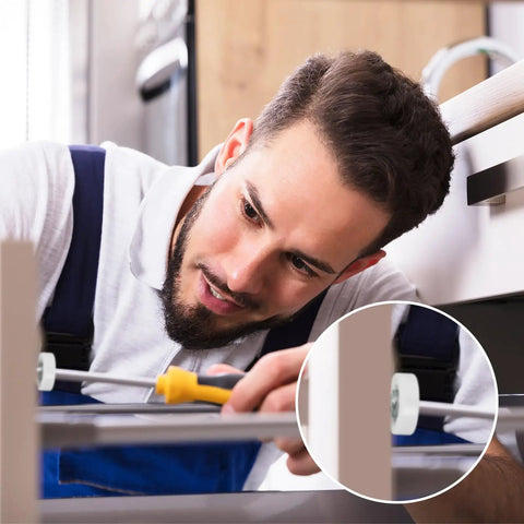 Man installing Heavy Duty 19Mm Drawer Rollers Replacement Pulley Wheels With Nuts on a drawer using a screwdriver.