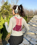 Back view of woman running with Lightweight Running Vest Hydration Backpack With Breathable Mesh Back Reflective Outdoor Daypack.