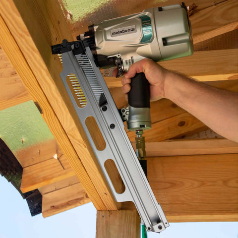 Top Shelf Pneumatic Framing Nailer With Smooth Operator Depth Tweaks and Heavy Duty Aluminum Magazine in use with wood.