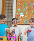 Children with goggles in front of colorful science lab wall decals for classroom and nursery, realistic test tubes and microscope stickers