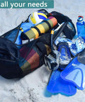 XXL Mesh Duffle Bag For Scuba Snorkel Gear And Water Sports Equipment with fins, mask, and beach gear on sand