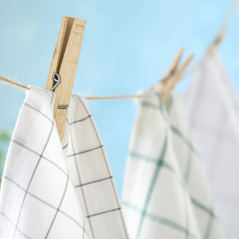 Tough As Nails Wooden Clothespins With Heavy Duty Spring Clip For Line Drying Laundry And Chip Bag Sealing Rust Resistant Coiled Design Non Slip Grip Bulk Pack Of 50 Absolute Go To For Crafting And Home Storage used to hang kitchen towels on a clothesline.