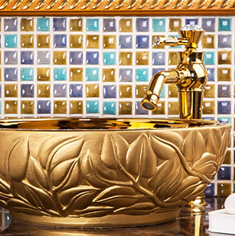 Super Slick Round Vessel Sink For Bathroom Vanity Killer Gold Ceramic Countertop Wash Basin with floral design and faucet.