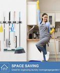 2 Pack Stainless Steel Wall Mount Broom Holder With 5 Racks And 4 Hooks Heavy Duty Self Adhesive Broom Organizer in kitchen