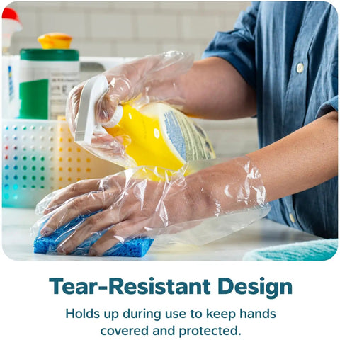 Person wearing Disposable Poly Gloves For Food Prep And Service, handling cleaning spray and sponge in kitchen.