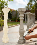 2-Piece Roman Column Balustrade Mold next to finished concrete pillars, outdoor DIY installation scene