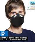 Man wearing black KN95 Face Masks 50 Pack for Adults and Teens, Disposable Black Masks With Breathable Comfort, 4 Layer Filtration.