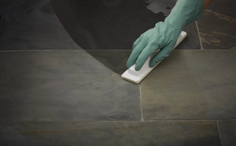 Application of Seal And Enhance Premium Sealing Solution For Stone And Tile Ready To Use Impregnator on dark stone surface