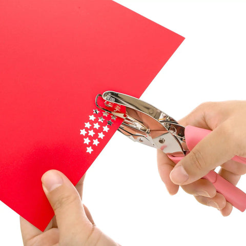 Five Pack Handheld Hole Punch Set With Metal Punches In Circle Heart And Star Shapes for DIY crafts, shown punching stars in red paper
