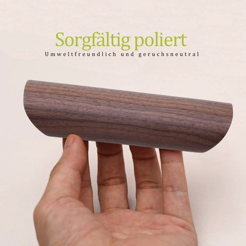 Hand holding Wooden Drawer Handles 4 Pack For Cabinet Cupboard Dresser And Wardrobe Drawers With 3.77 Inch Hole Distance in Black Walnut.
