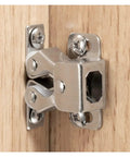 Antique Copper Cabinet Door Roller Catches With Double Latches, Striker And Mounting Screws on wooden cabinet corner, close-up