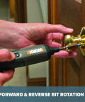 Person using 4V Cordless Screwdriver With Three Speed Settings to install a door knob, demonstrating compact handy grip design.