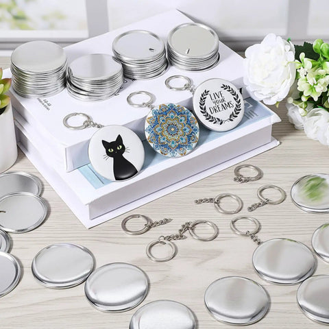 100 Set 58mm Button Maker Kit With Metal Shells Transparent Film Back Covers And Black Rings For DIY Button Keychains Use This All In One Press Pack For Crafty Creators showing components and finished keychains with designs.