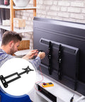 Rock Solid Adjustable Wall Mount Swivel Arm For 14 To 24 Inch Lcd Led Monitor Tv Bracket installed on back of TV during setup.