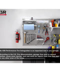 Heavy Duty Compact Fire Extinguisher For Cars Trucks Race Rigs Clean Halotron Formula mounted on garage wall with tools.