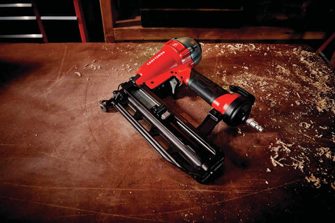 Finish Nailer 16 Gauge Pneumatic With Oil Free Motor on workbench, showcasing maintenance free operation and tool free features.