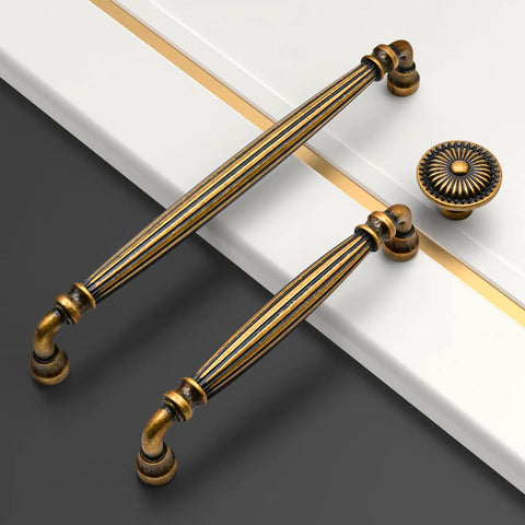 10 Pack 5 Inch Brushed Antique Brass Kitchen Cabinet Handles Super Easy Install Metal Pulls Rust Proof Finish Anti Corrosion Heavy Duty Durable Cabinet Hardware For Modern Kitchens, close-up on white cabinet