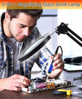 Man using Real Glass Magnifier With Light And 15X Magnification while repairing electronics, showing pro grade 72 LED illumination.