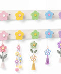 Tot Approved Flower Shaped Kids Coat Rack 2 Piece Wall Hook Set Rainbow Colors with floral accents and tassels for nursery decor.