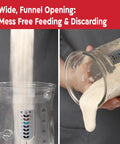 34 Oz Large Capacity Sourdough Starter Jar With Funnel Opening And Silicone Cover in use for easy feeding and discarding.