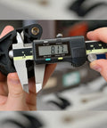 6 Inch Caliper With Absolute AOS Encoder measuring part, showing ultra accurate 0.0005 inch, 0.01 mm resolution in use