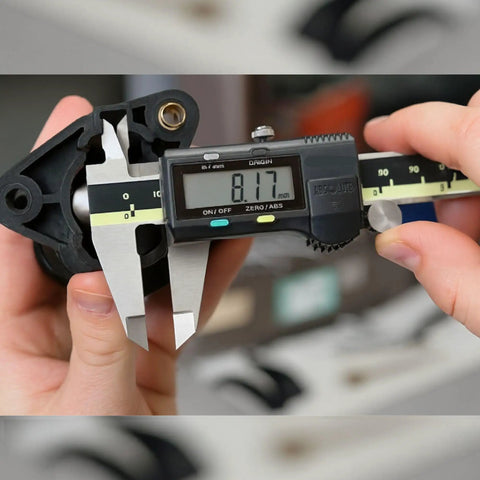 6 Inch Caliper With Absolute AOS Encoder measuring part, showing ultra accurate 0.0005 inch, 0.01 mm resolution in use