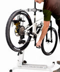 Cyclist using the Bike Balance Trainer And Repair Stand Combo For Cyclists Build Core Stability Quick Reaction Time And Full Body Strength
