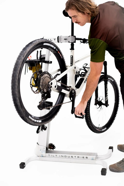 Cyclist using the Bike Balance Trainer And Repair Stand Combo For Cyclists Build Core Stability Quick Reaction Time And Full Body Strength