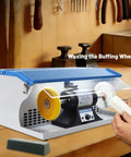 Pro Grade Heavy Duty 500W Jewelry Bench Polisher With Integrated Dust Collector And Adjustable Speed Control For Serious Jewelers Kickin Torque Motor Double Head Grinding Buffing Station in use for waxing the buffing wheel.
