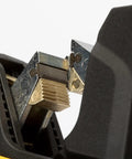 Close-up of ergonomic automatic wire stripper for AS-Interface cables with PUR or TPE insulation, featuring spare blades.
