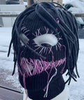 Distressed Balaclava Face Mask With Halloween Spooky Style in black and pink knit, resembling a scary full face ski mask.