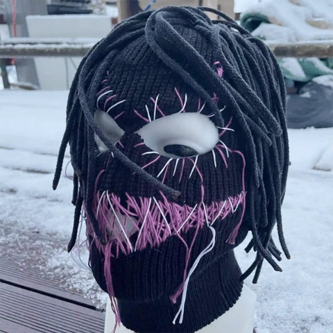 Distressed Balaclava Face Mask With Halloween Spooky Style in black and pink knit, resembling a scary full face ski mask.