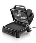 Open view of Woodfire Outdoor Grill And Smoker With Four In One Functionality For Real Woodfire Flavor And Sear Crave Ready Backyard Grilling Bake And Roast All In One Electric Heat OG301 showing grill grate and interior fan.
