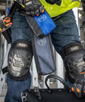 Person holding Stand Up Zipper Tool Bags Set With Carabiners, 7 Inch Blue and 14 Inch Gray Pouches, reinforced bottom.