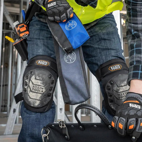 Person holding Stand Up Zipper Tool Bags Set With Carabiners, 7 Inch Blue and 14 Inch Gray Pouches, reinforced bottom.