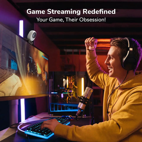 Piko Dual Camera 4K AI Webcam With AI Autofocus streaming setup, featuring gamer with headset in front of monitor