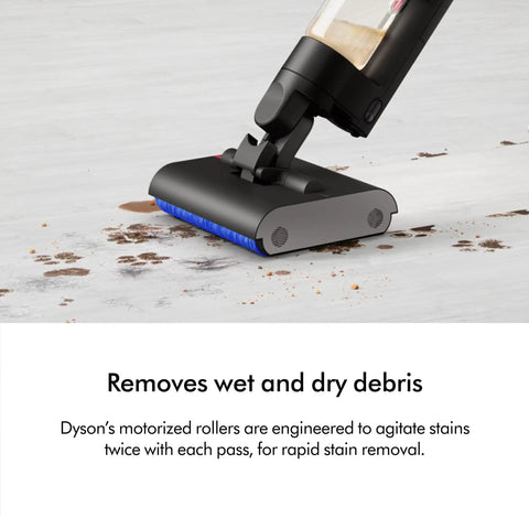 WashG1 Wet Cleaner cleaning tabletop, dual motorized rollers lifting wet and dry debris, matte black and ultra blue finish