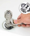 Hand using Tub Drain Remover Wrench Tool For Shower And Bathtub Built Tough Aluminum Dual Ended Fits 1 3 8 Inch And 1 1 2 Inch Drain Shoes PL0030 Easy Removal And Installation