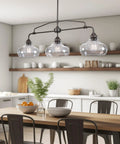 38 Inch 3 Light Modern Schoolhouse Island Light With Clear Glass Shades, Industrial Farmhouse Oil Rubbed Bronze Finish in kitchen