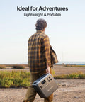 Person carrying Your Go To Portable Power Station AC180 1152Wh LiFePO4 Battery Backup With Two 1800W AC Outlets in open field.