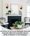 Black Wall Sconces Set Of Two With Linen Fabric Lampshades next to mirror on white wall above fireplace in living room