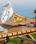 Portable Gas Camping Heater For Tent Garage And Workshop Reliable Outdoor Heat on a wooden picnic table by the lake.