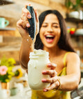 Person using Powerful Handheld Milk Frother For Coffee Lovers, Quick Foam Maker Whisk For Lattes, Cappuccinos, in kitchen