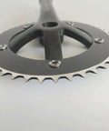 Close-up view of anodized black 44T/46T Aluminum Crankset, 170mm Crankarms, 130 BCD Square Taper for mountain road and fixed gear bikes.
