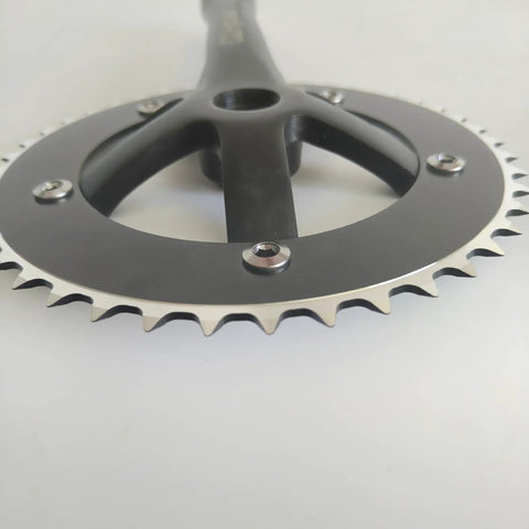 Close-up view of anodized black 44T/46T Aluminum Crankset, 170mm Crankarms, 130 BCD Square Taper for mountain road and fixed gear bikes.