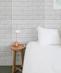 Bedroom with White 3D Faux Brick Wallpaper Peel And Stick Panels For Easy DIY Home Makeover, foam wall decor behind the bed.